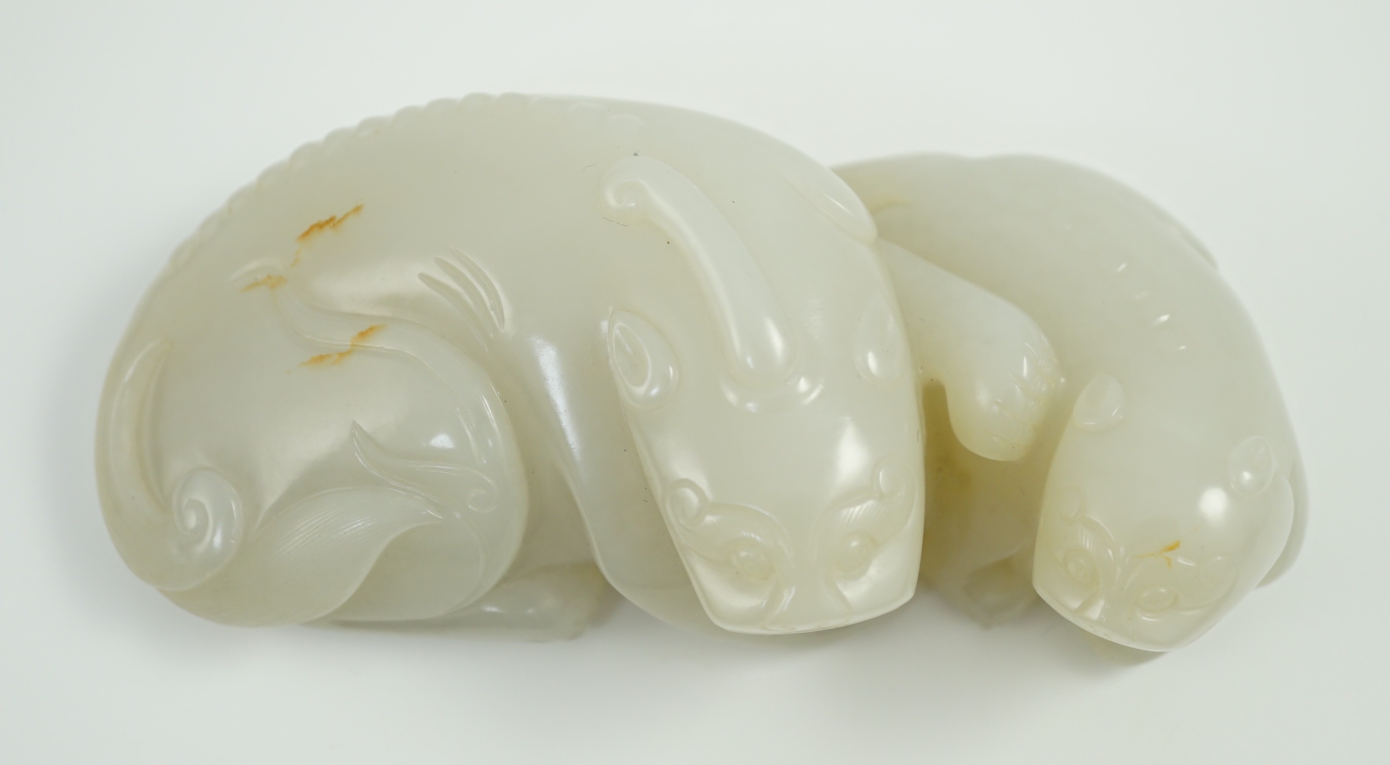 A Chinese white jade mythical beast group, 12cm long